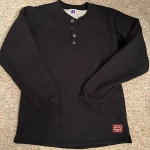 Black Russell Athletic quarter button thrusted sweatshirt.